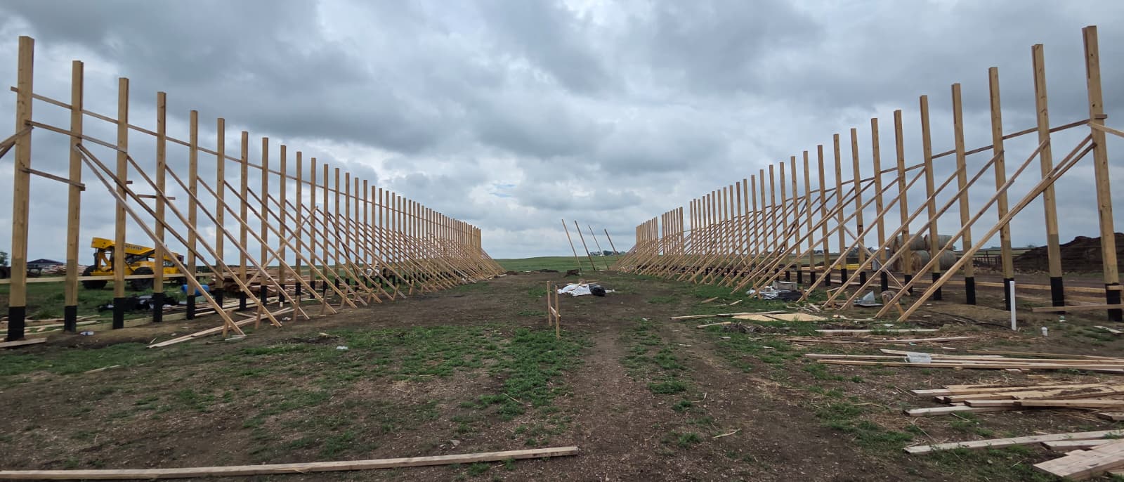 Post-frame construction, row of posts set